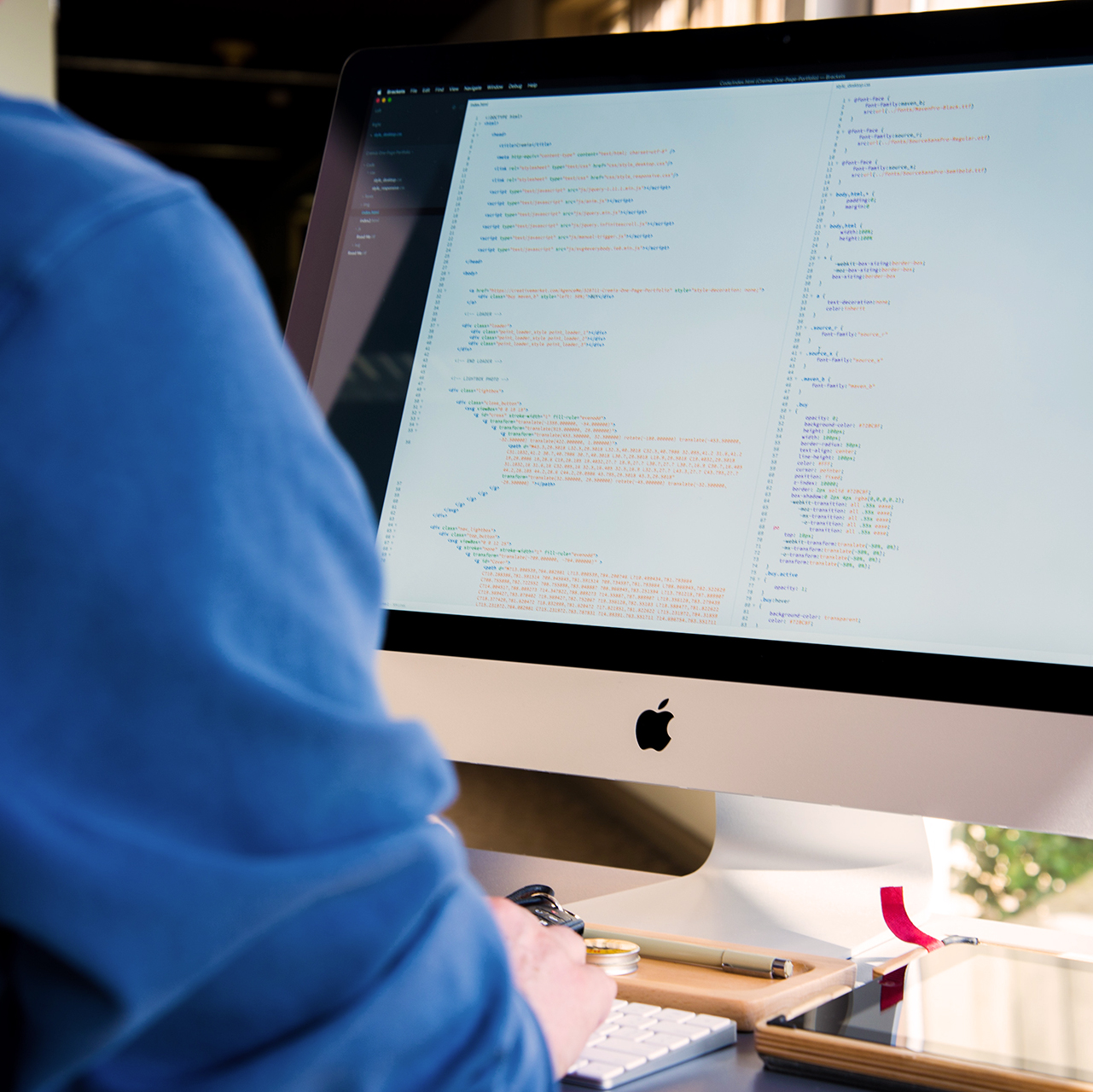 iMac computer closeup with some code