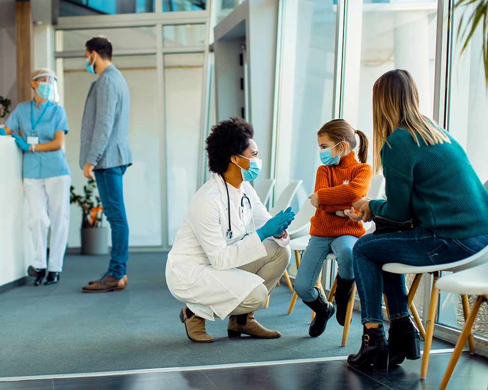 Doctor comforting a child patient