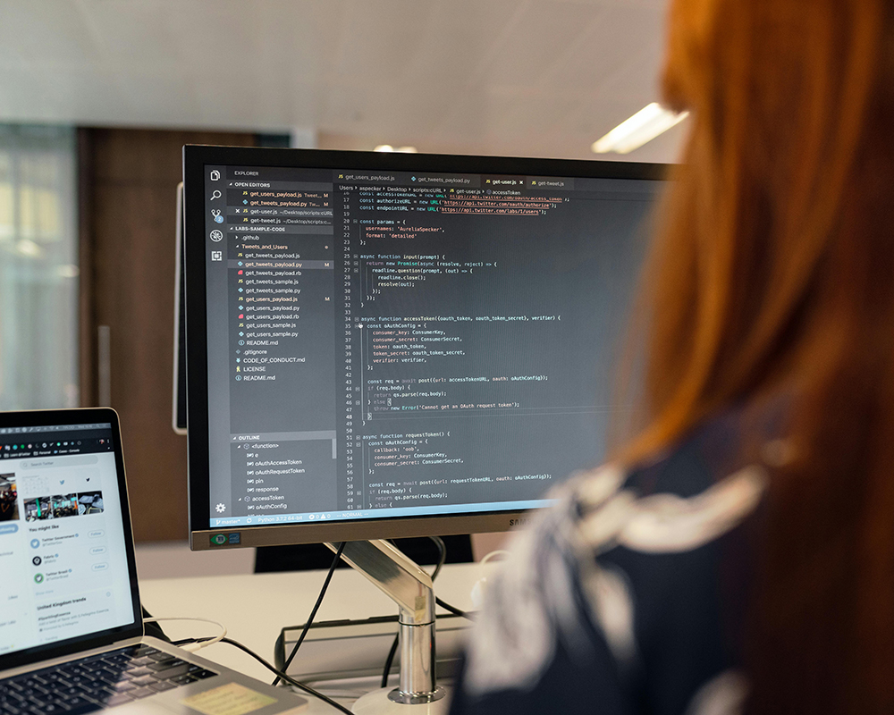 Developer debugging code on her MacBook